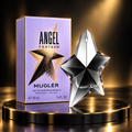 Mugler Angel Fantasm 50 mL black and silver star bottle beside lavender carton on black and gold podium
